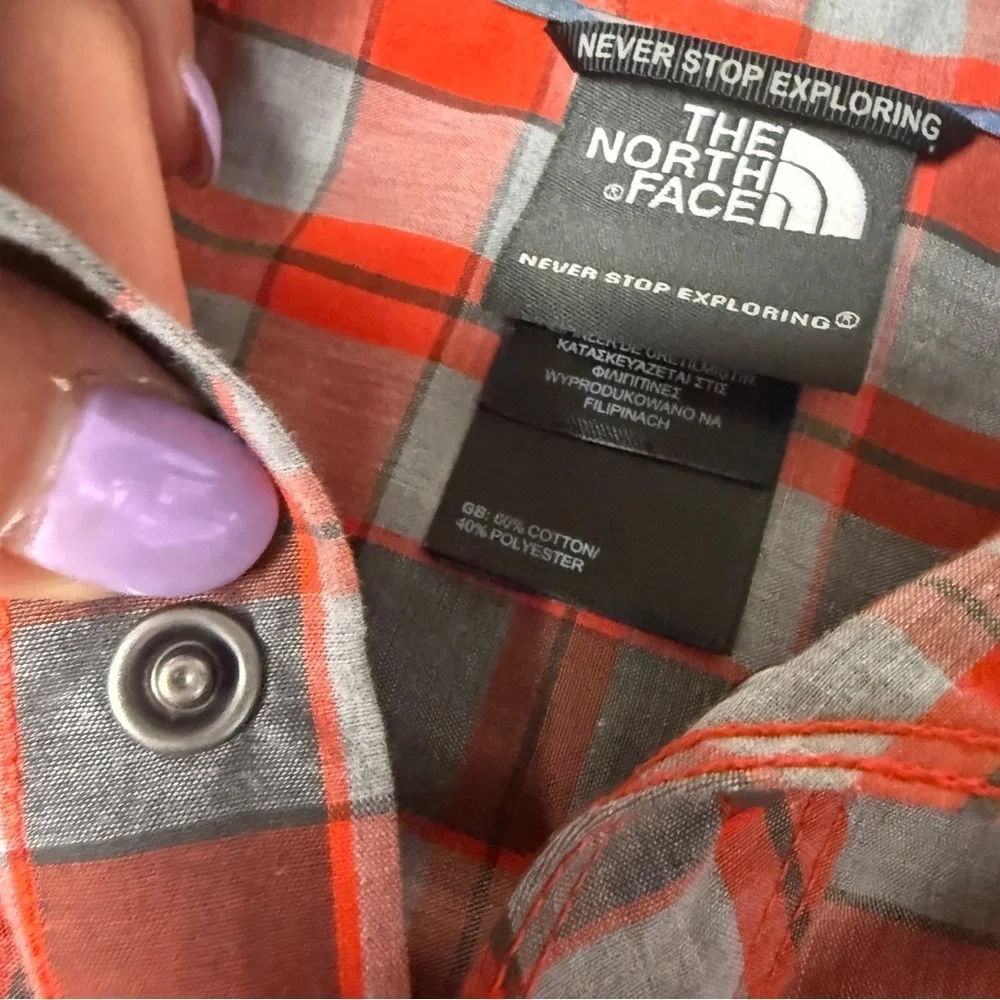 The North Face Orange and Gray Plaid Shirt snaps